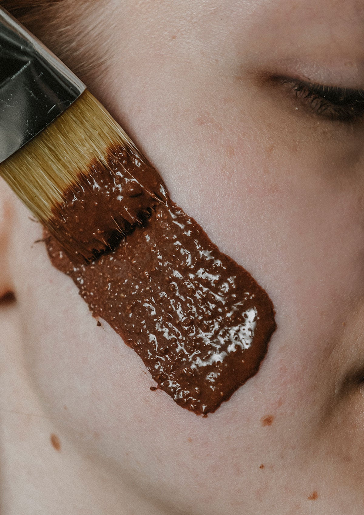 Brightening face mask in action — Niki Newd® Cocoa Mask revives dull skin and smooths fine lines.