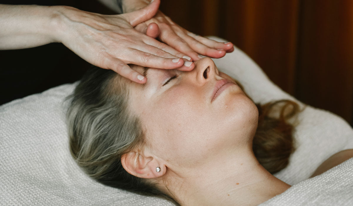 Niki Newd® face massage — timeless hands meet fresh skin for natural radiance.