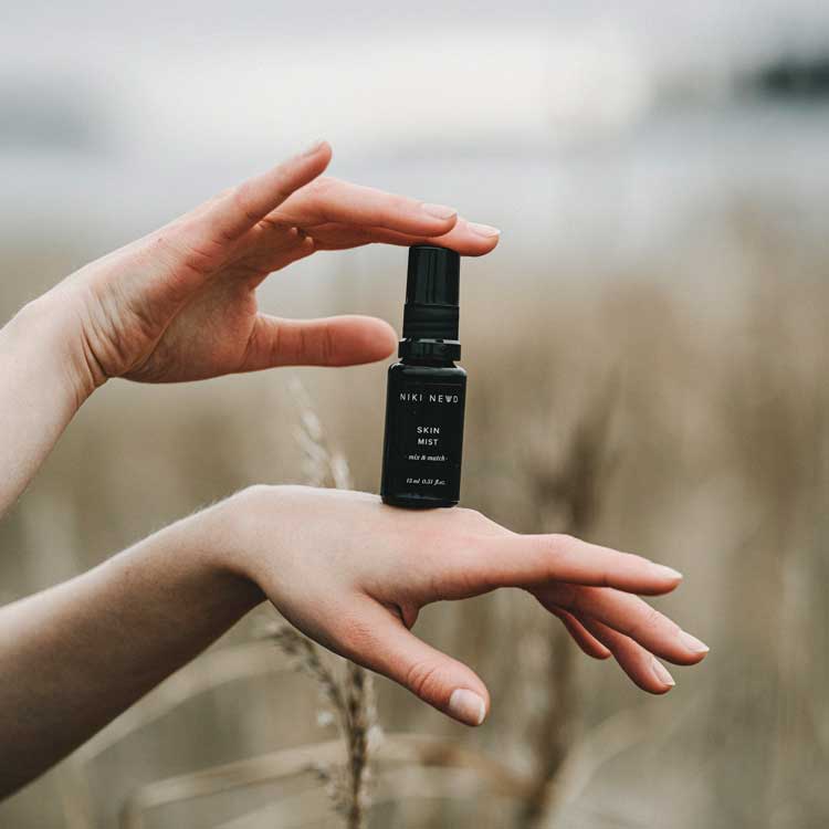 Niki Newd Skin Mist hydrating vitamin C facial spray to blend with face cream or oil serum for added moisture and a more even-looking skin tone.