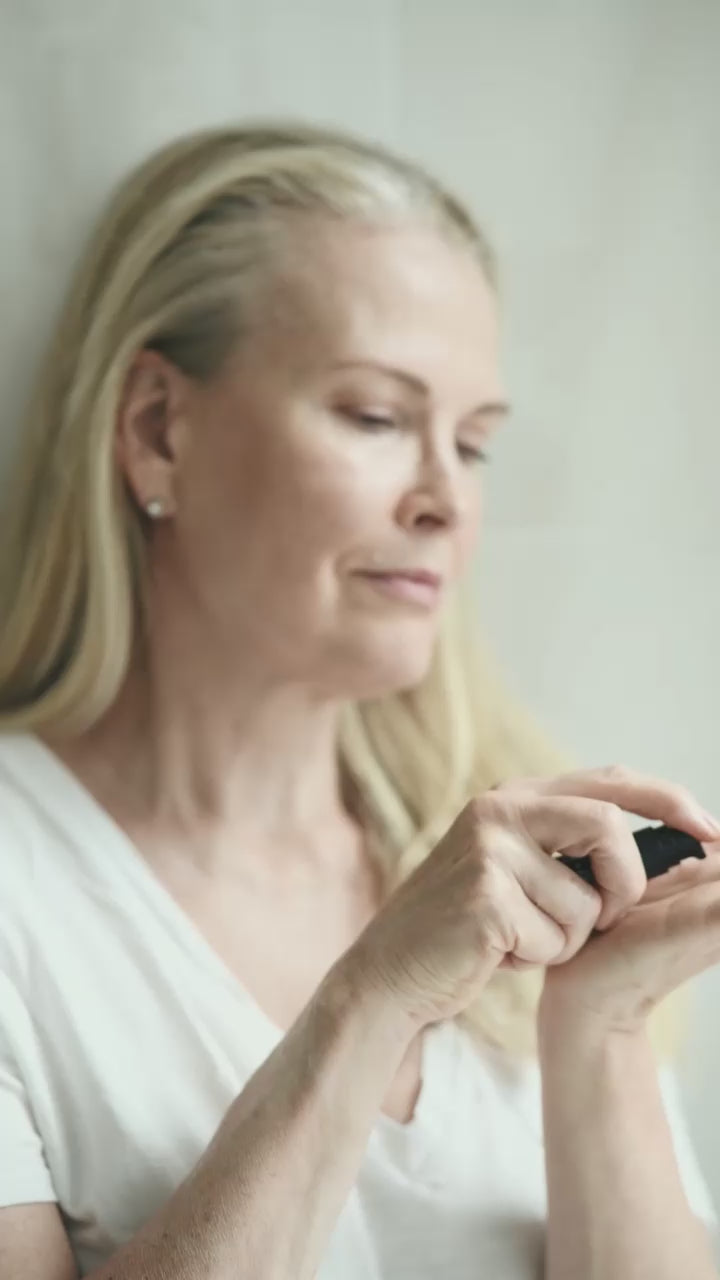 Niki Newd Skin Velvet antioxidant oil serum gently applied to the face, nourishing mature skin for a smoother, more luminous look.