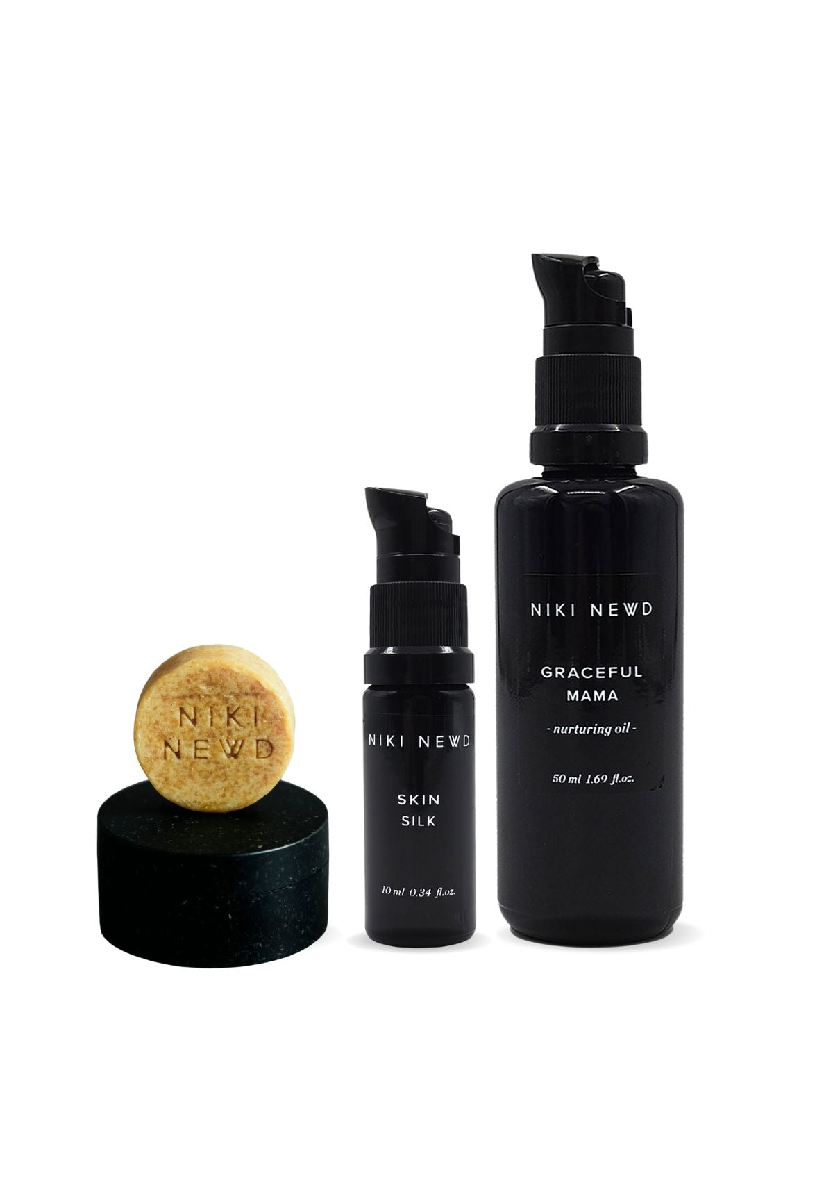 Niki Newd® skincare set featuring a cleansing bar, face serum, and nourishing oil serum.